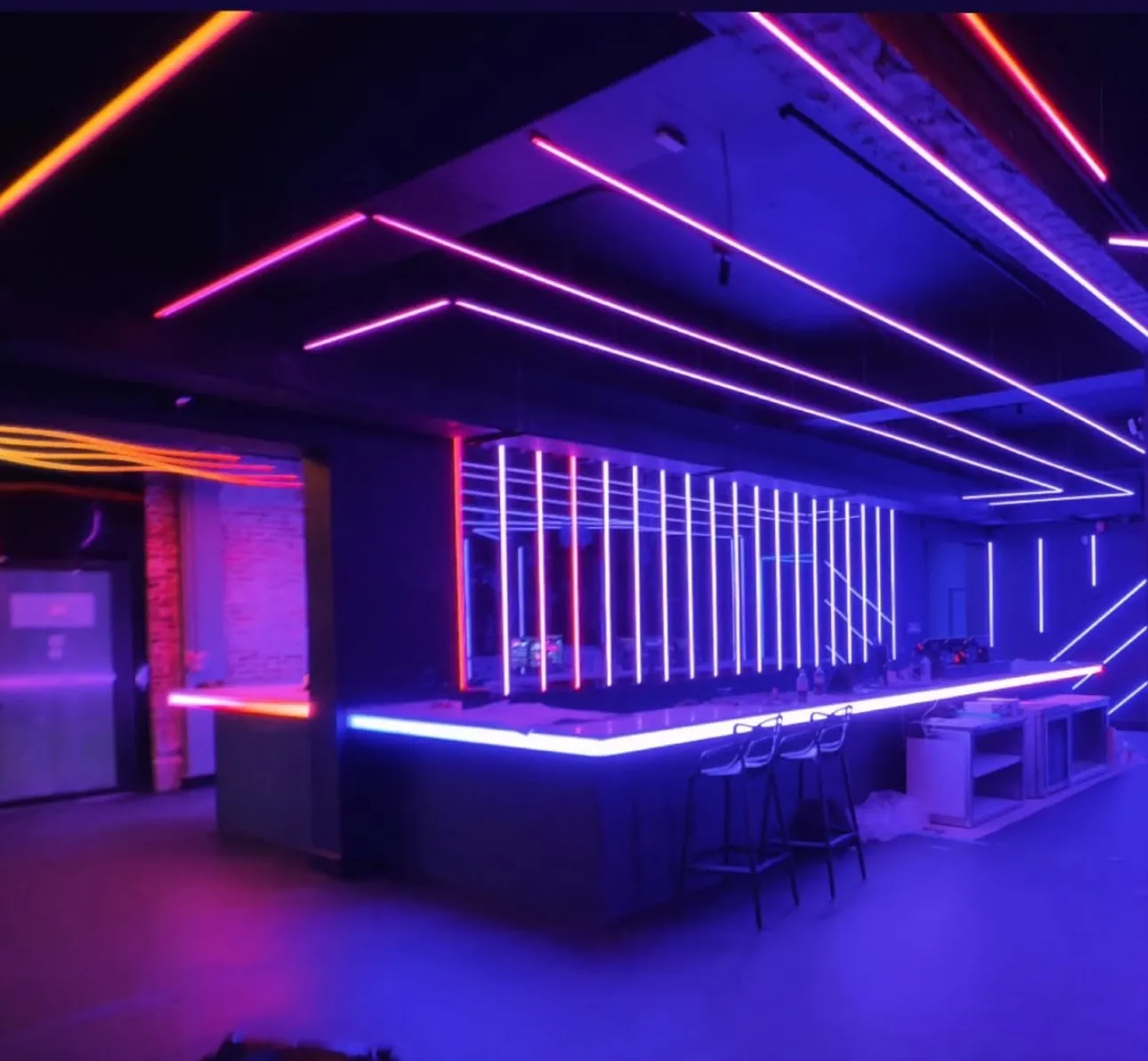 Finished bar at Anthem Orlando with purple and pink neon line lighting