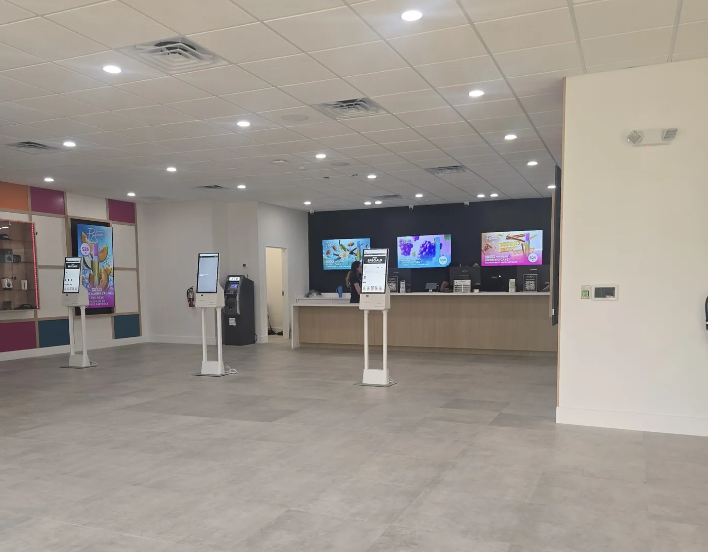 Open retail floor of the RWB Brandon dispensary with display screens and kiosks