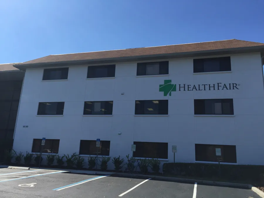 Three-storey office building exterior with HealthFair signage